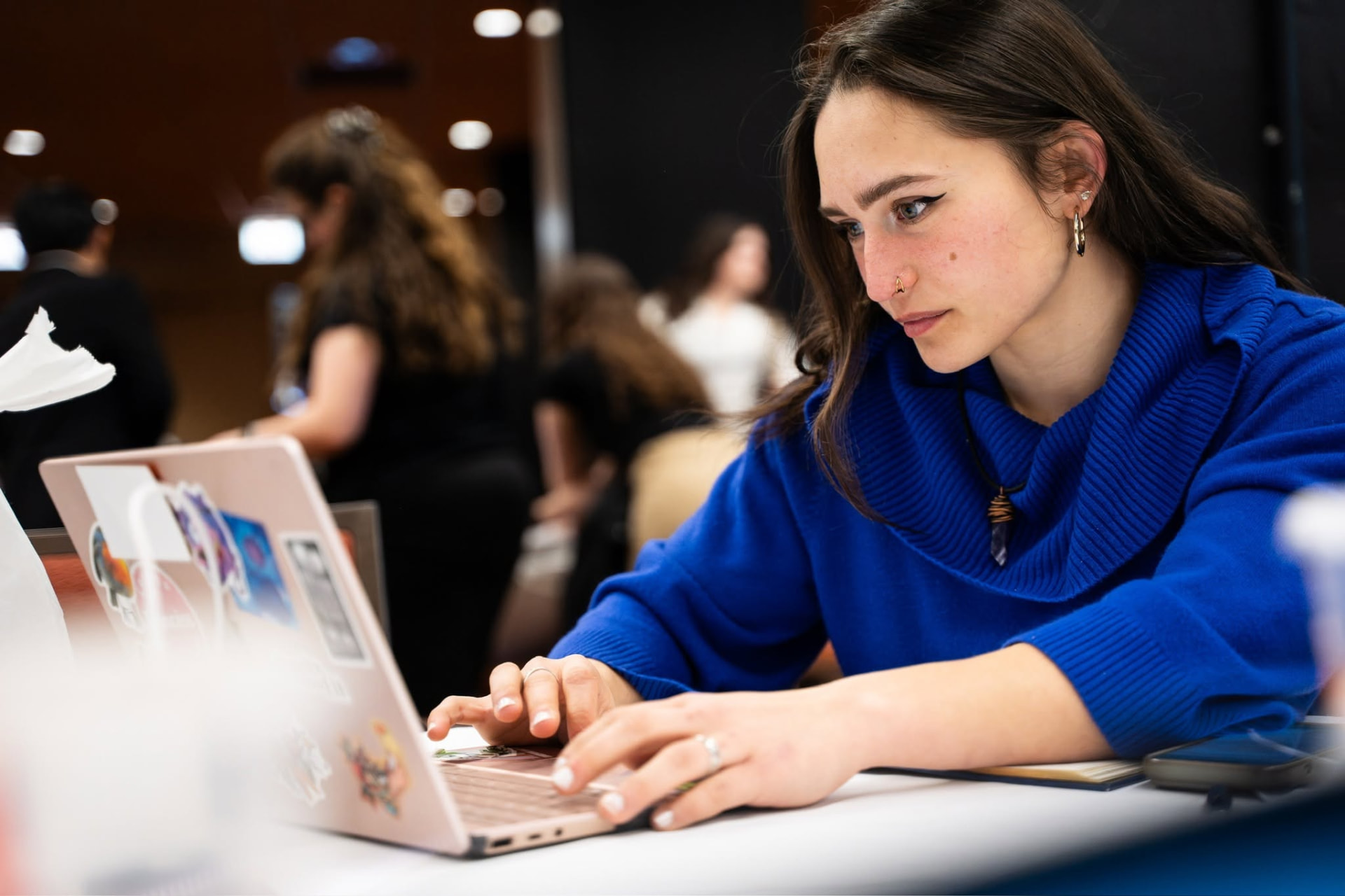 Software engineer working on a laptop while preparing verification evidence